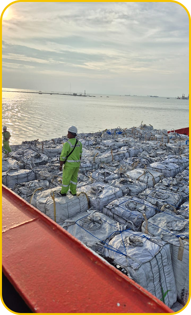 Crew inspecting jumbo bags on deck